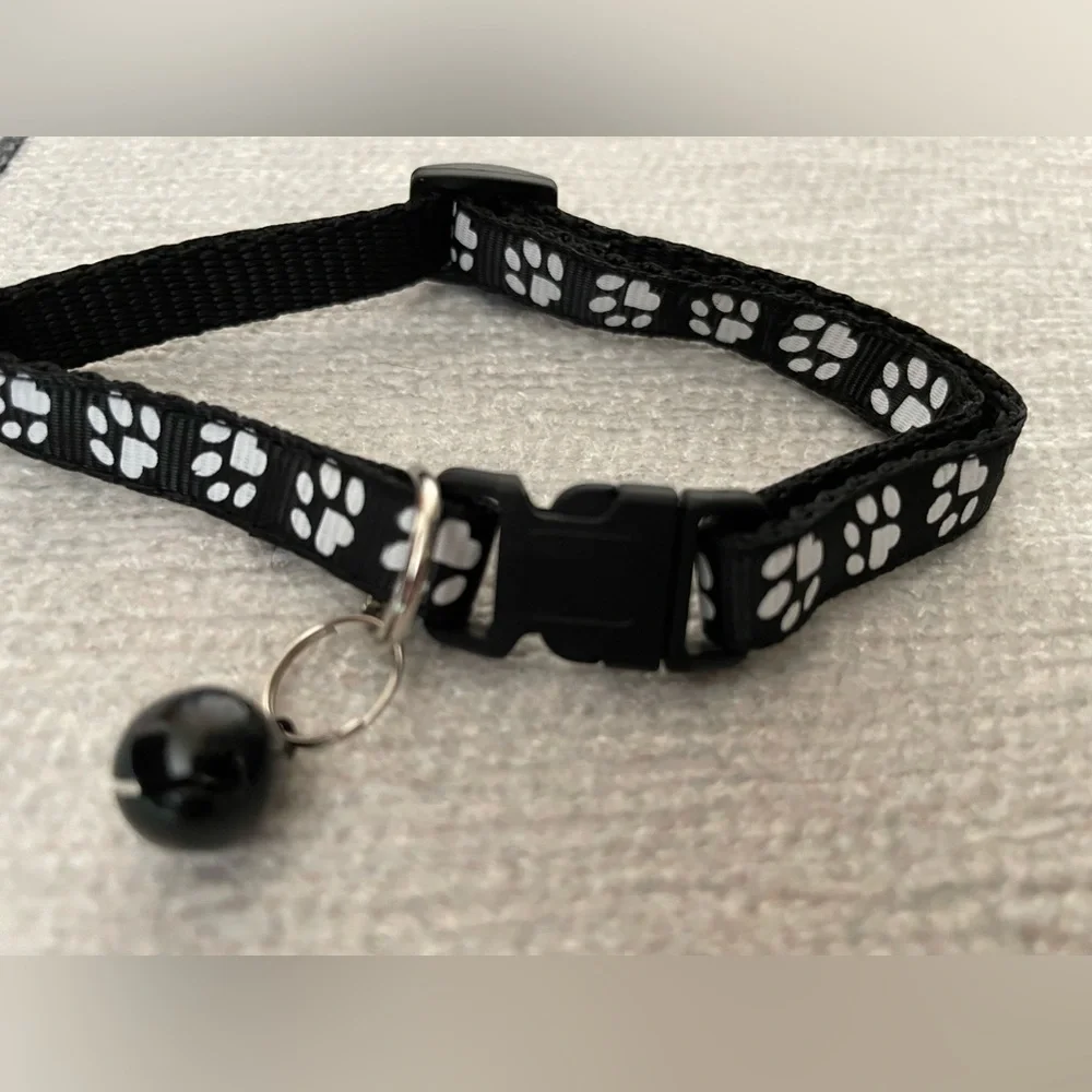 Collar with White Paw Print Pattern and Matching Bell and Buckle